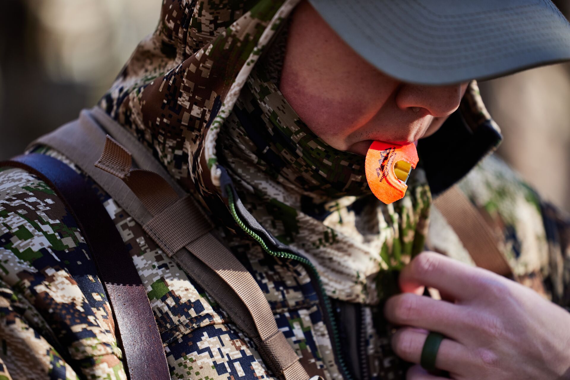 Hunter using turkey diaphragm call. 