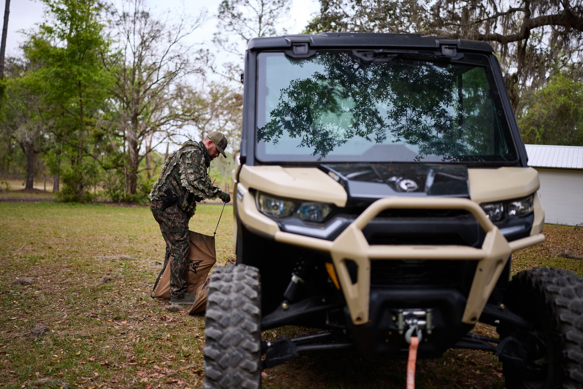Hunter with ATV prepares for hunt, how to scout for turkeys concept. 