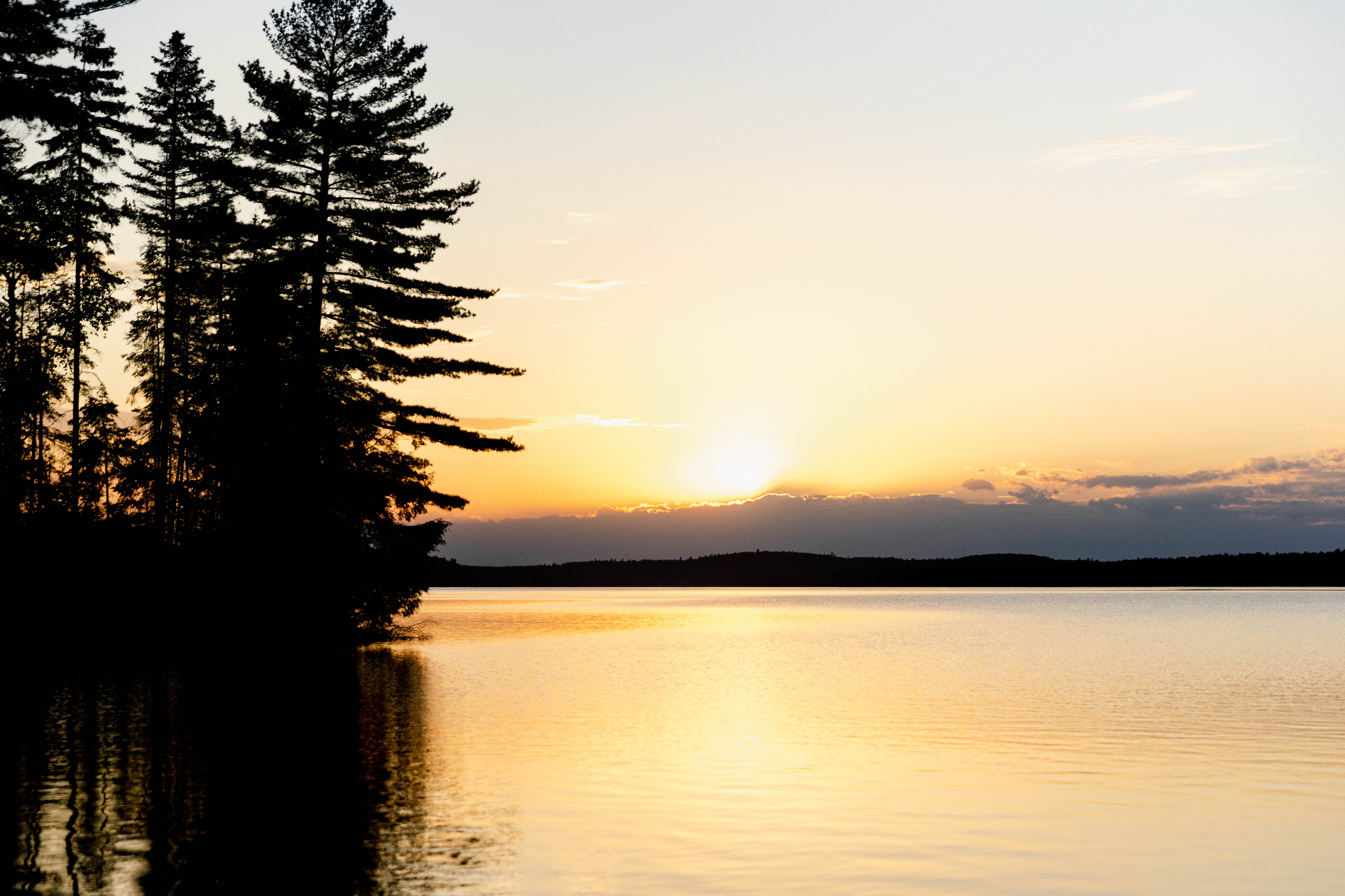 Photo of the water at sunset, hunters looking for boater safety course online concept. 