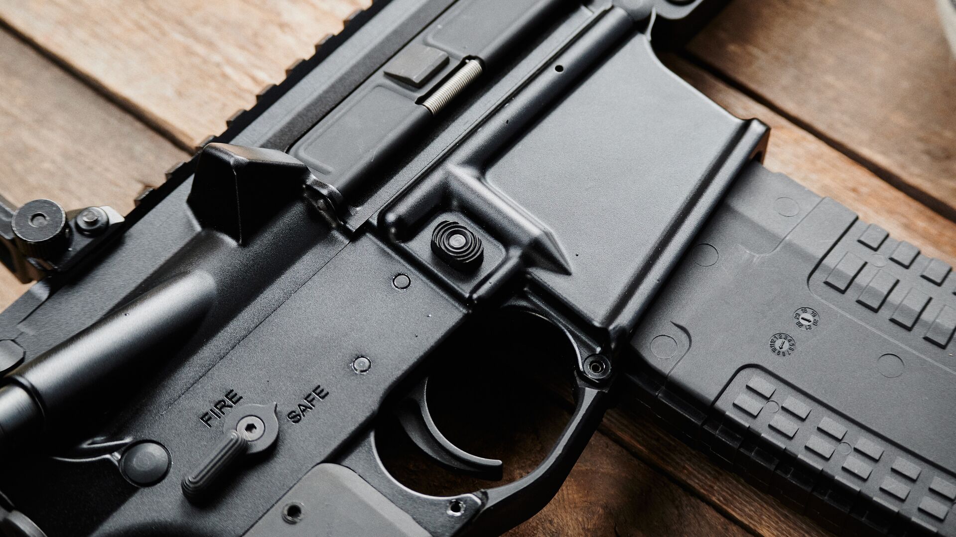 Close-up of AR-15 magazine and trigger, what does AR stand for concept.