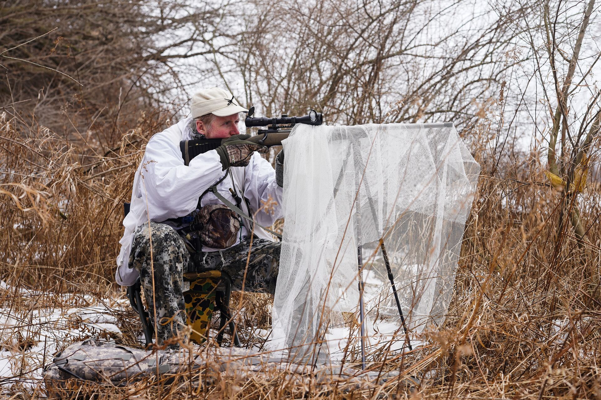 A hunter set up for a coyote hunt.
