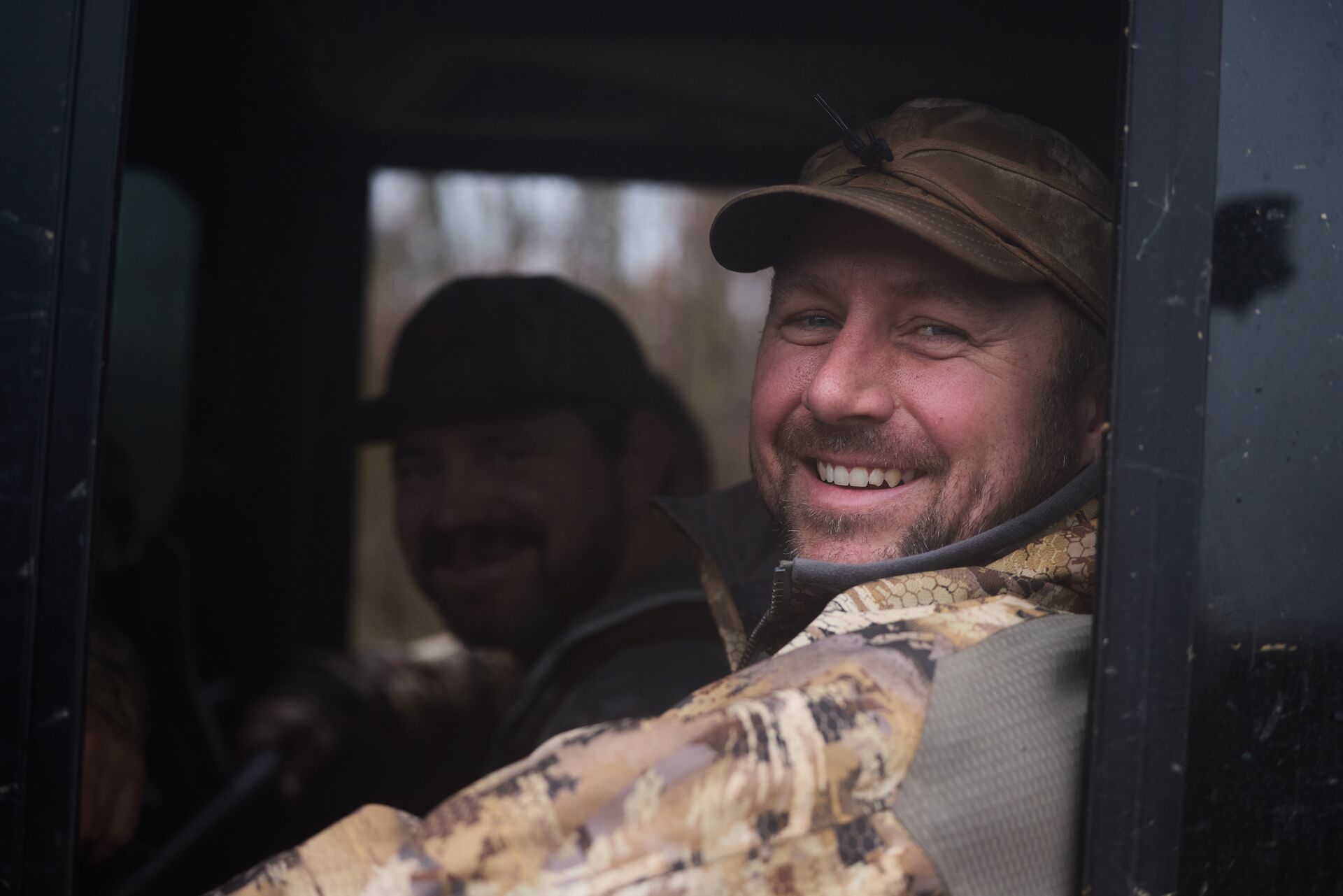 Smiling hunters in an ATV, landowner permission to hunt pennsylvania concept.