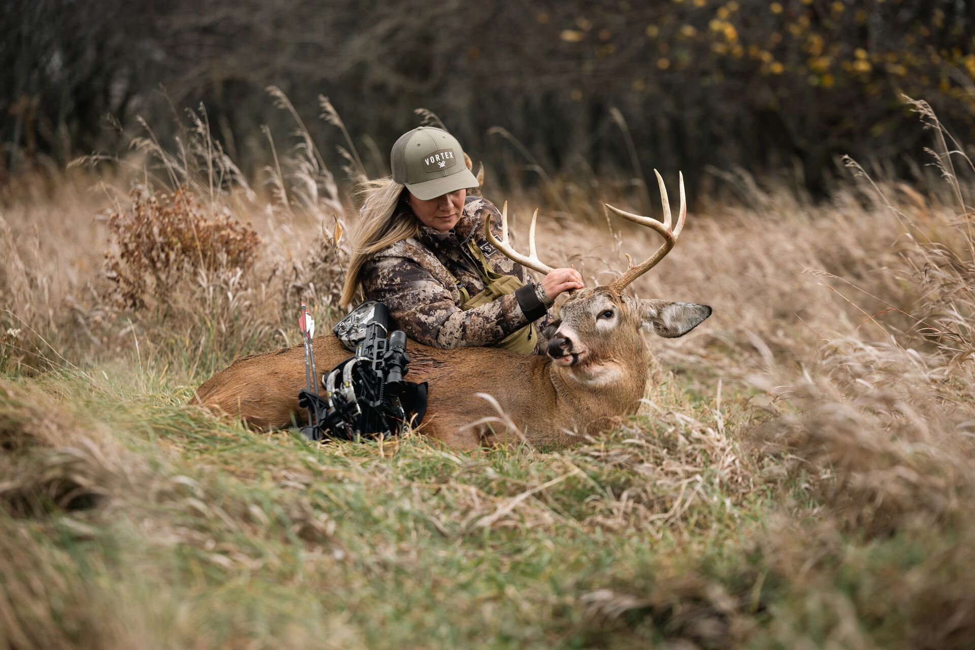 Female hunter with buck deer after hunt, Texas deer hunting season concept. 