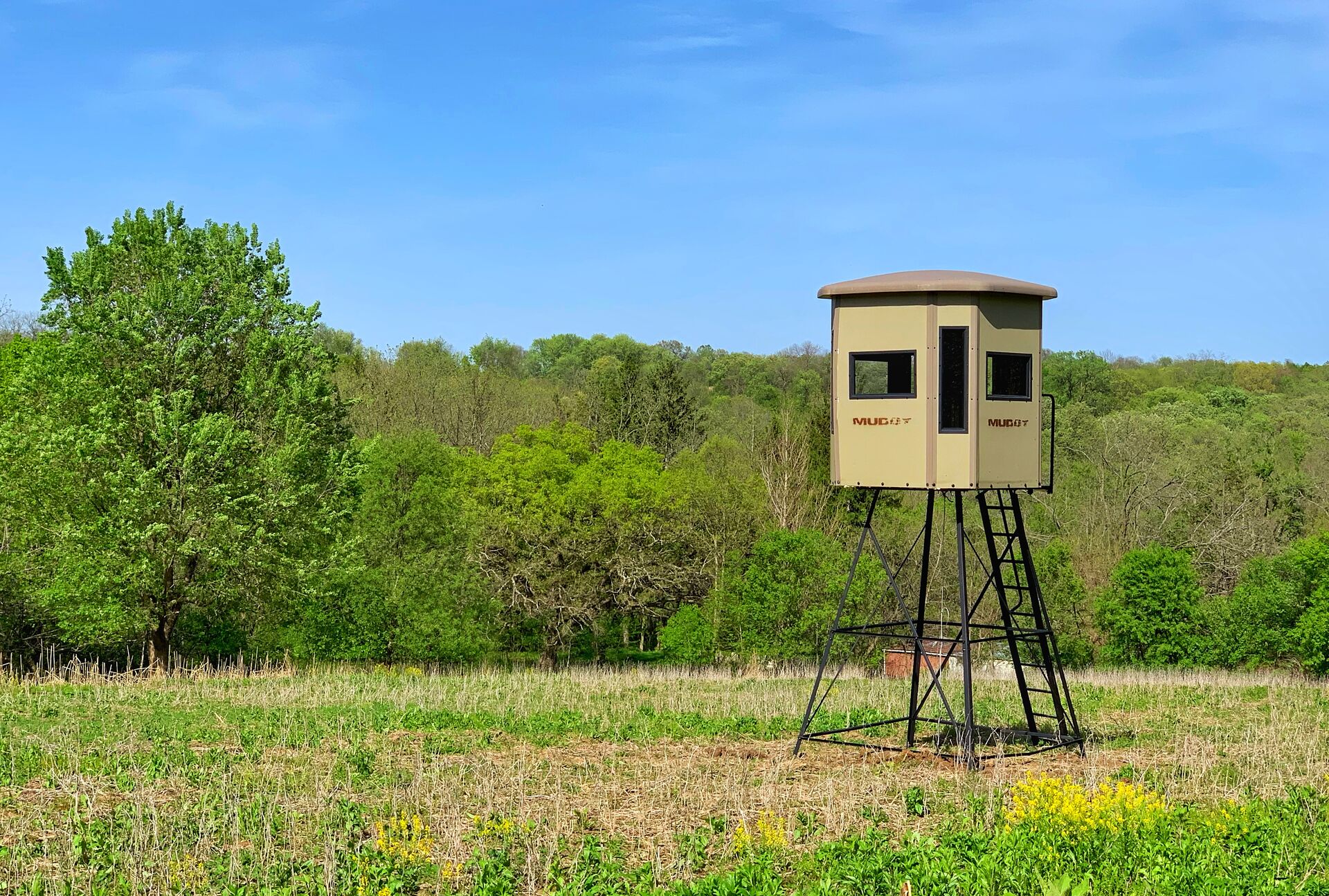 Elevated hunting blind in a field for deer season. 