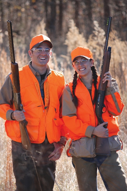 A man and woman hunt together, hunting partners.