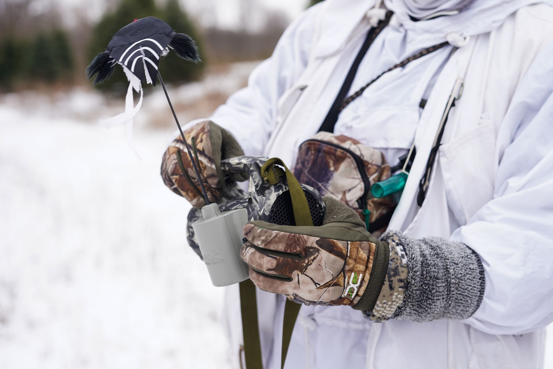 Hunter holds electronic coyote call.