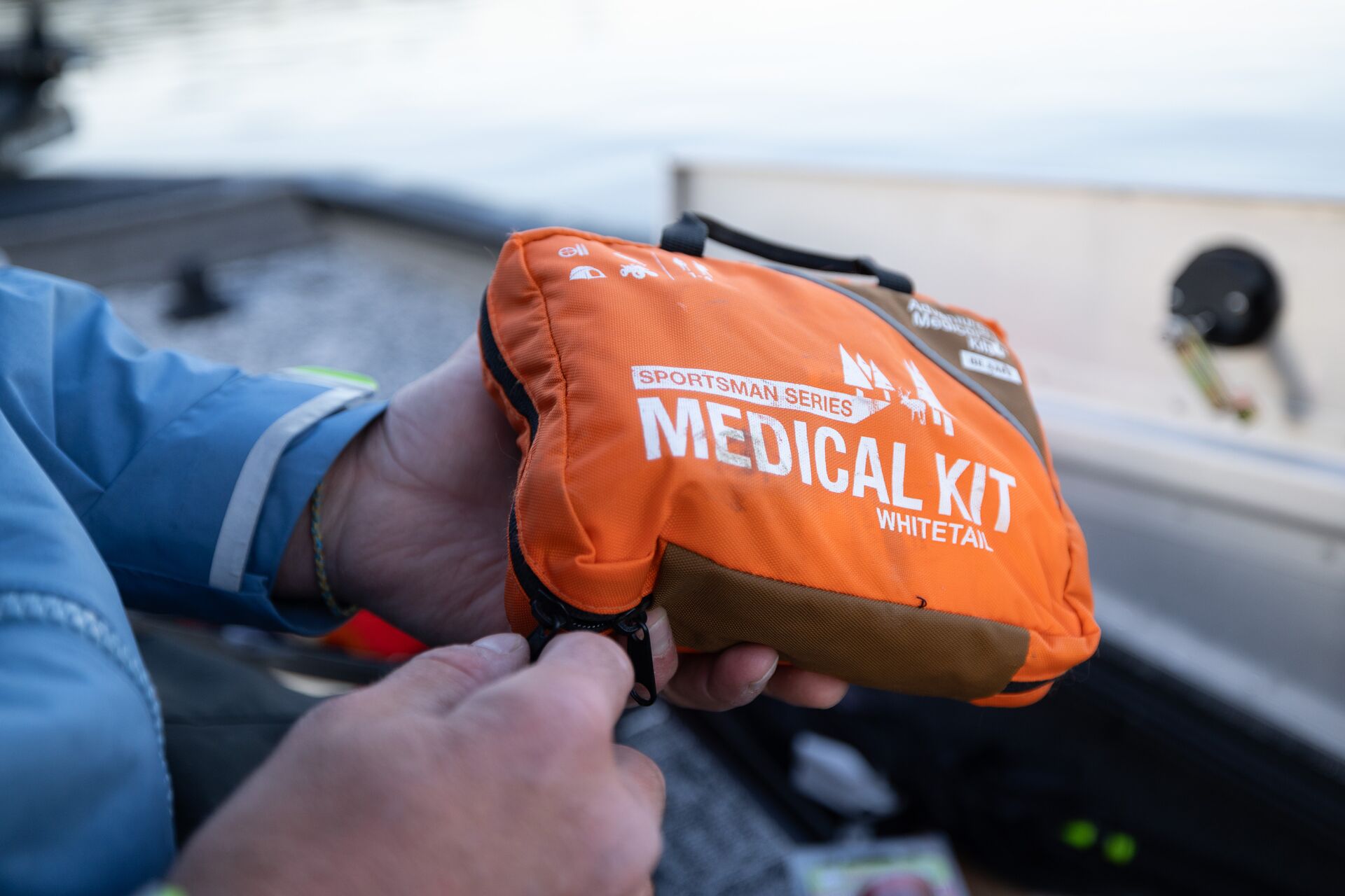 Close-up of a medical kit in someone's hands, hunting safety checklist concept.