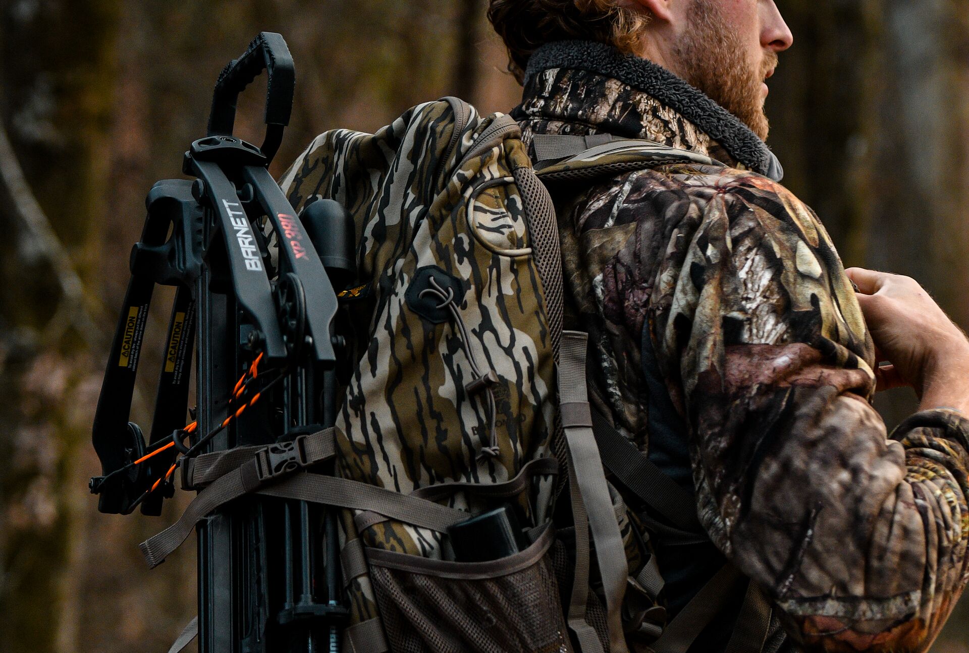 Hunter with full backpack and crossbow, hunting gear for beginners concept.