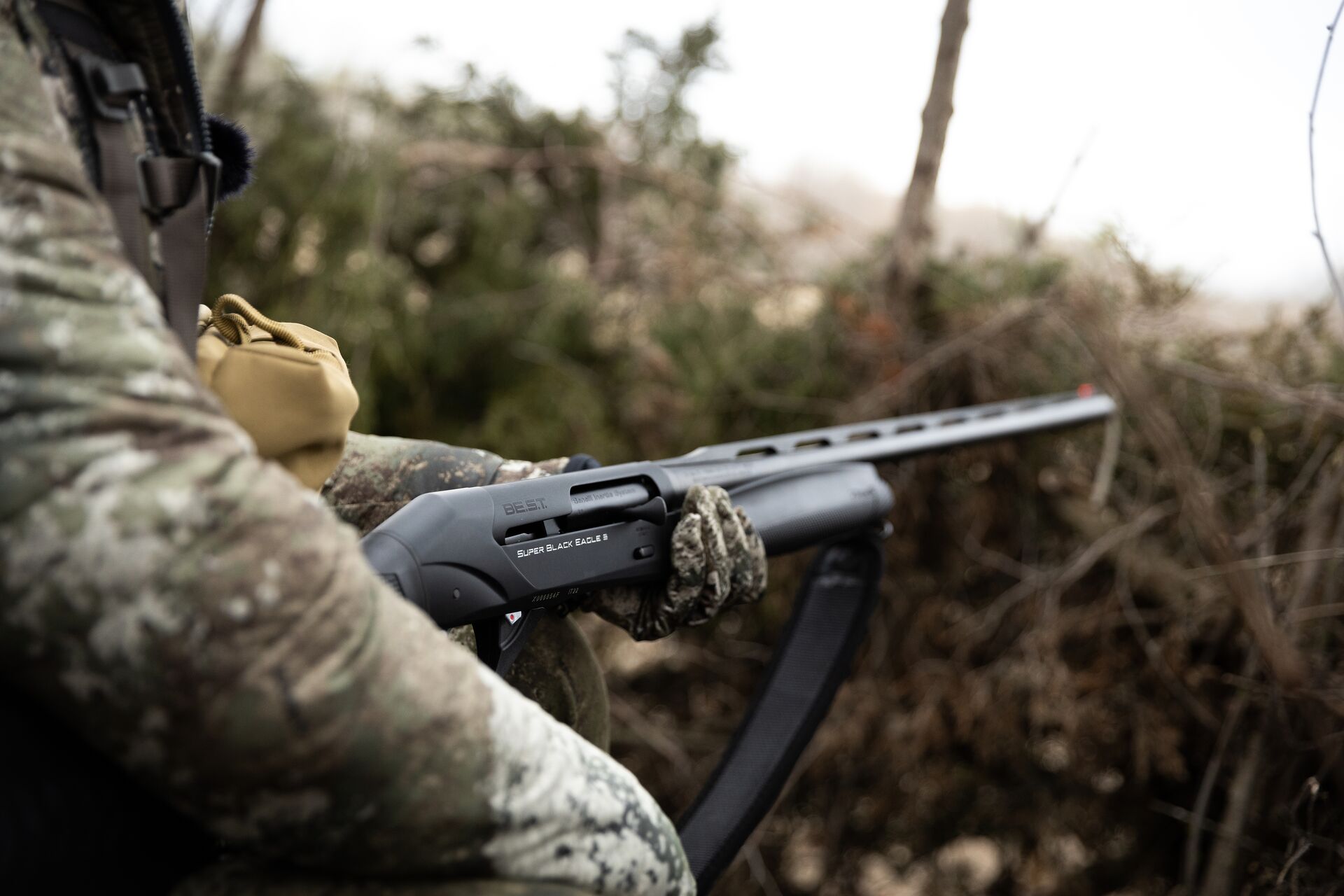 Close-up of a firearm in a hunter's hands, Michigan hunting license cost concept.