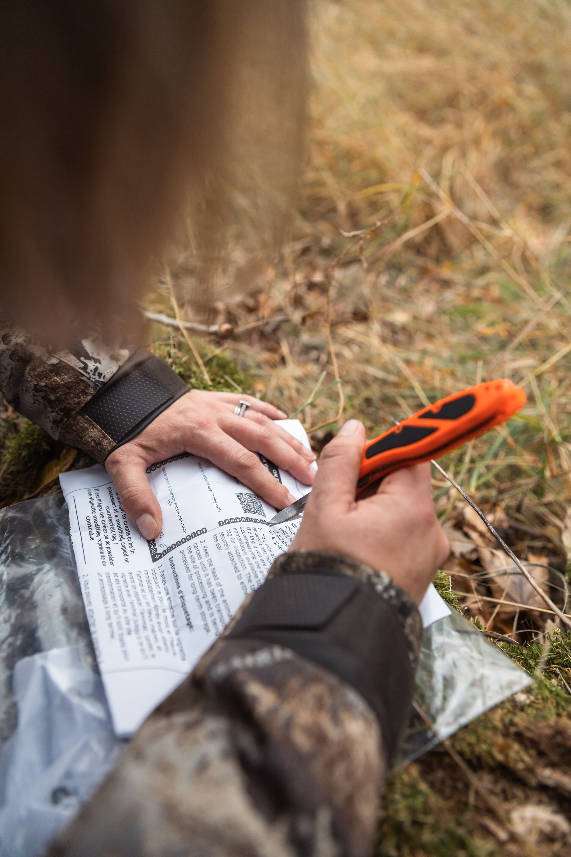 Hunter marking a hunting tag, how do hunting tags work concept.