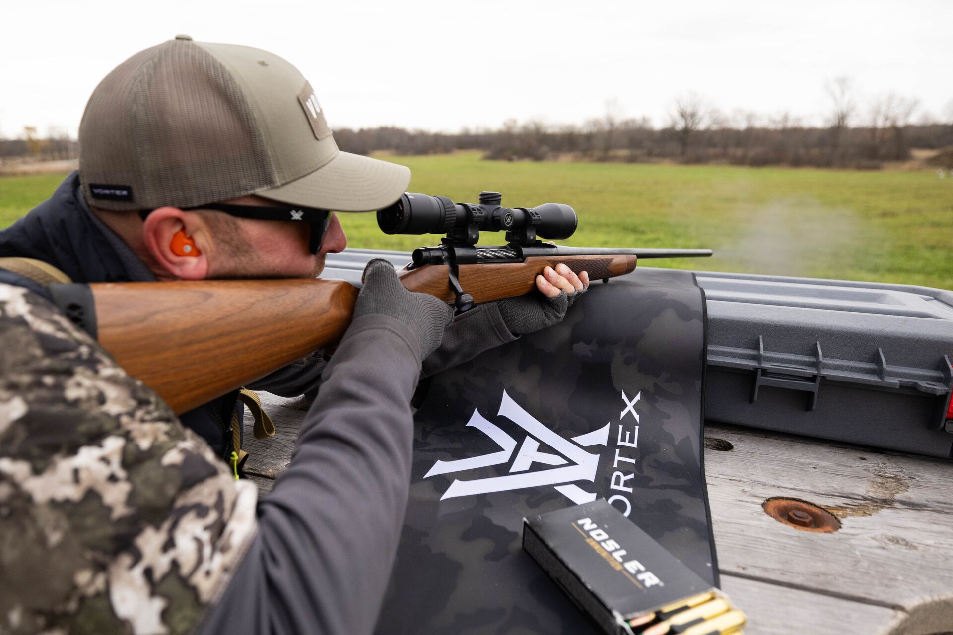 Hunter aims rifle at shooting range, take a hunter education course concept. 