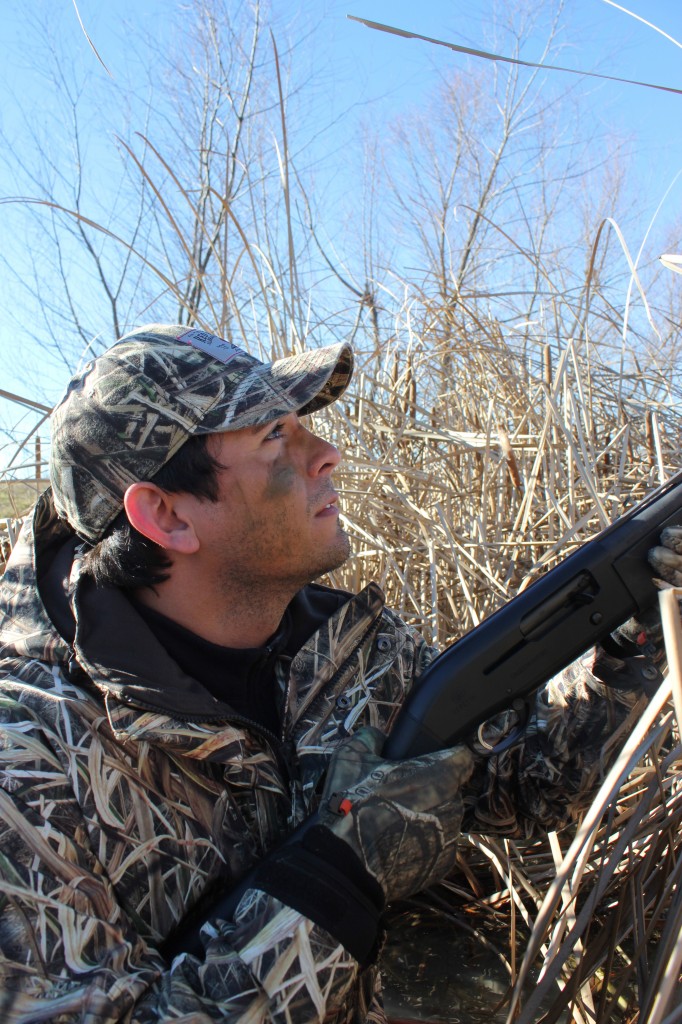 A duck hunter with a shotgun, how to duck hunt concept. 